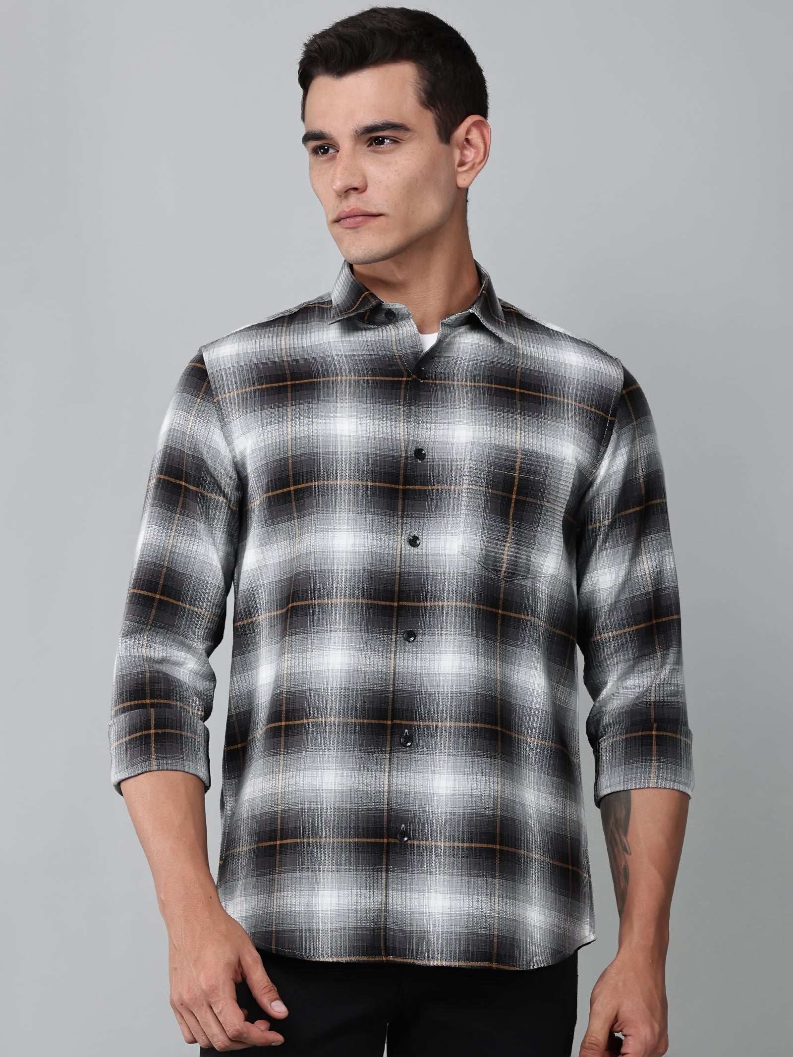 a model wearing a graphite gradient checkered shirt