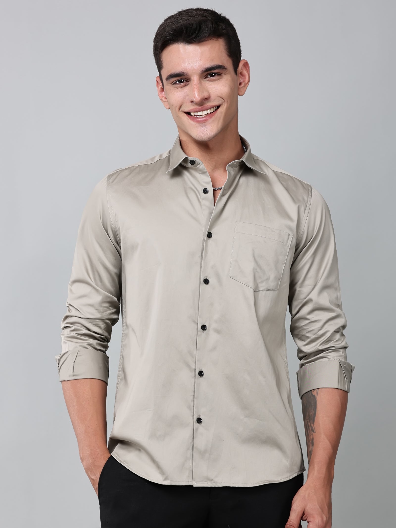 a model wearing a luxe satin ivory stone shirt