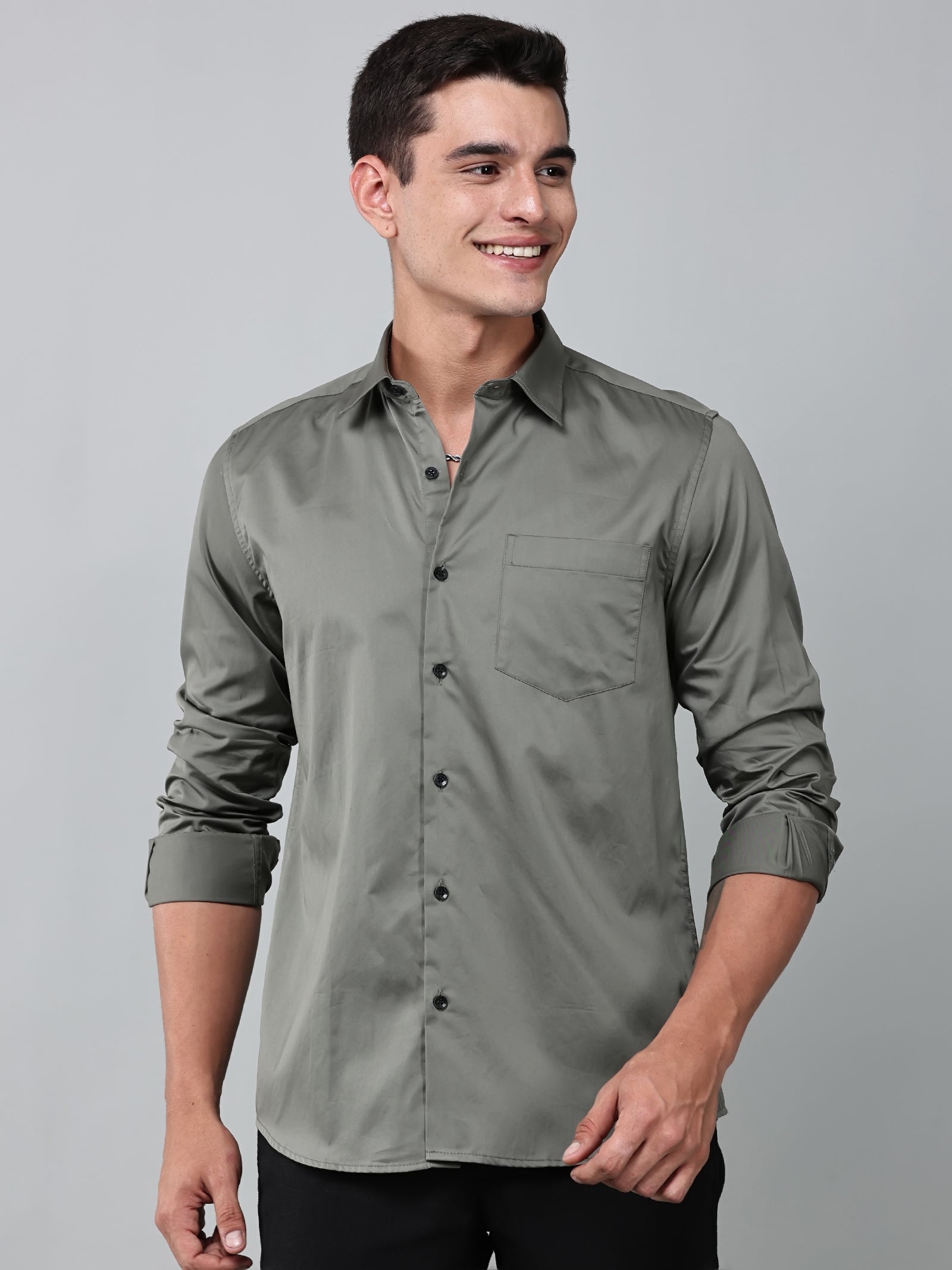 a model wearing a luxe satin olive green shirt