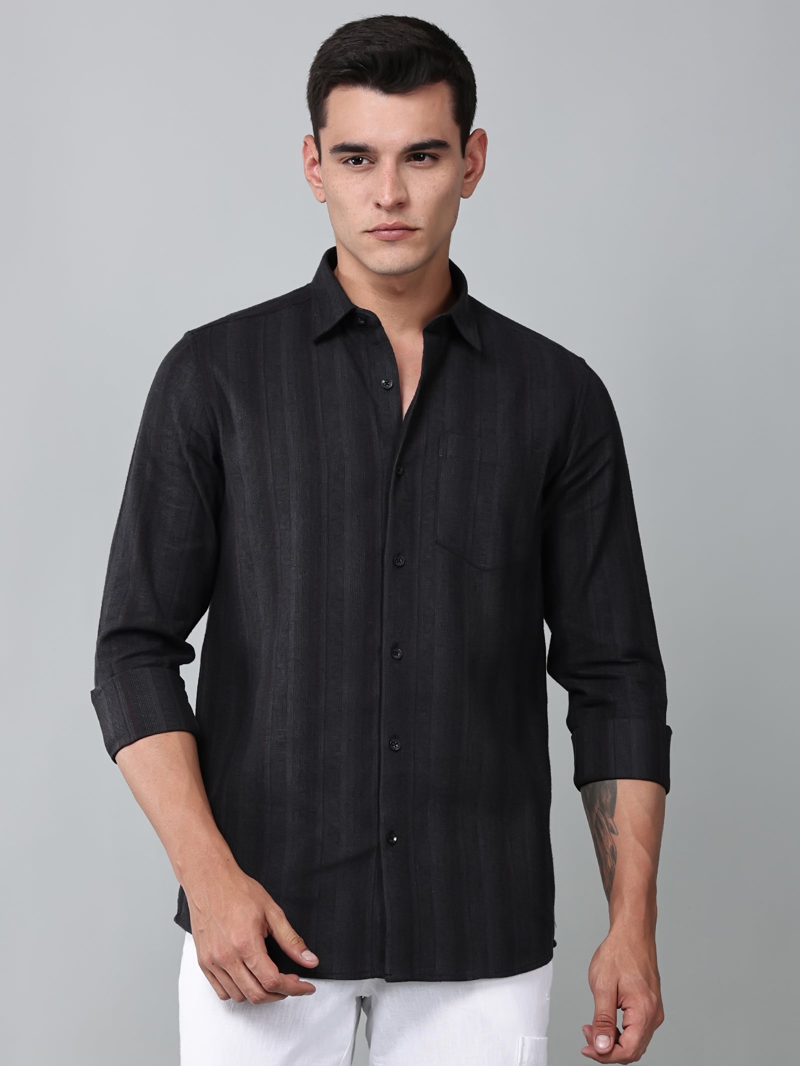 a model wearing a midnight noir (black) obsidian shirt
