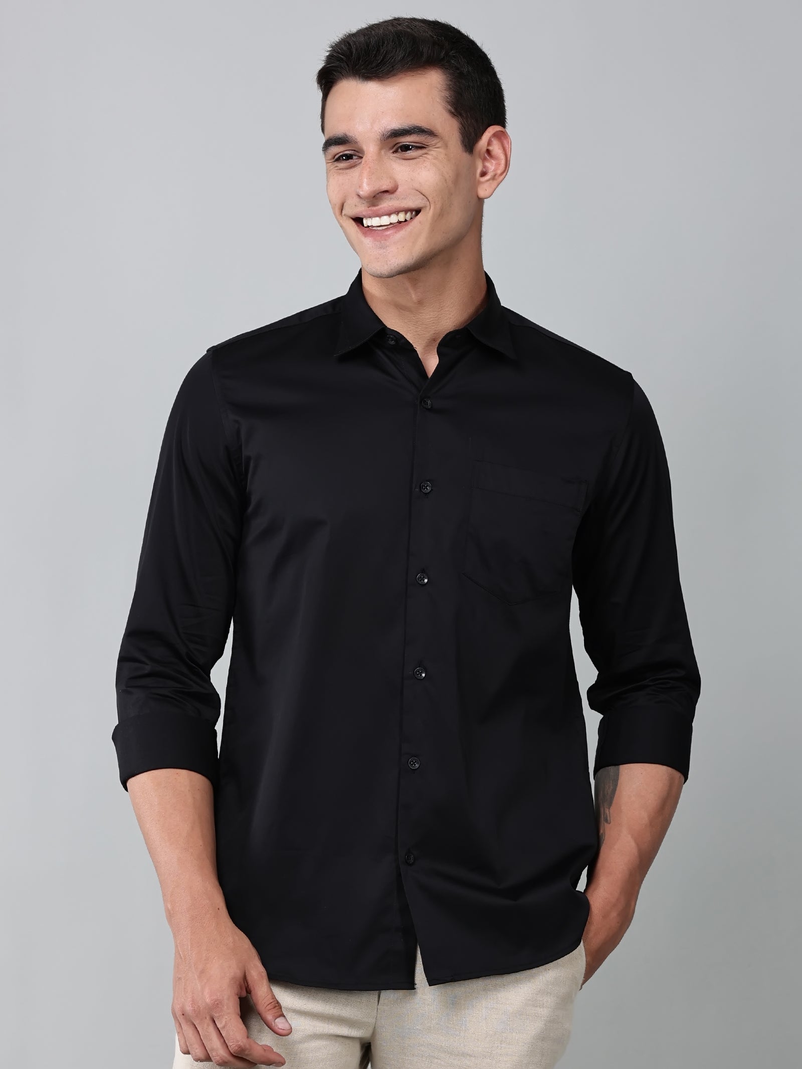 a model wearing a luxe satin black shirt
