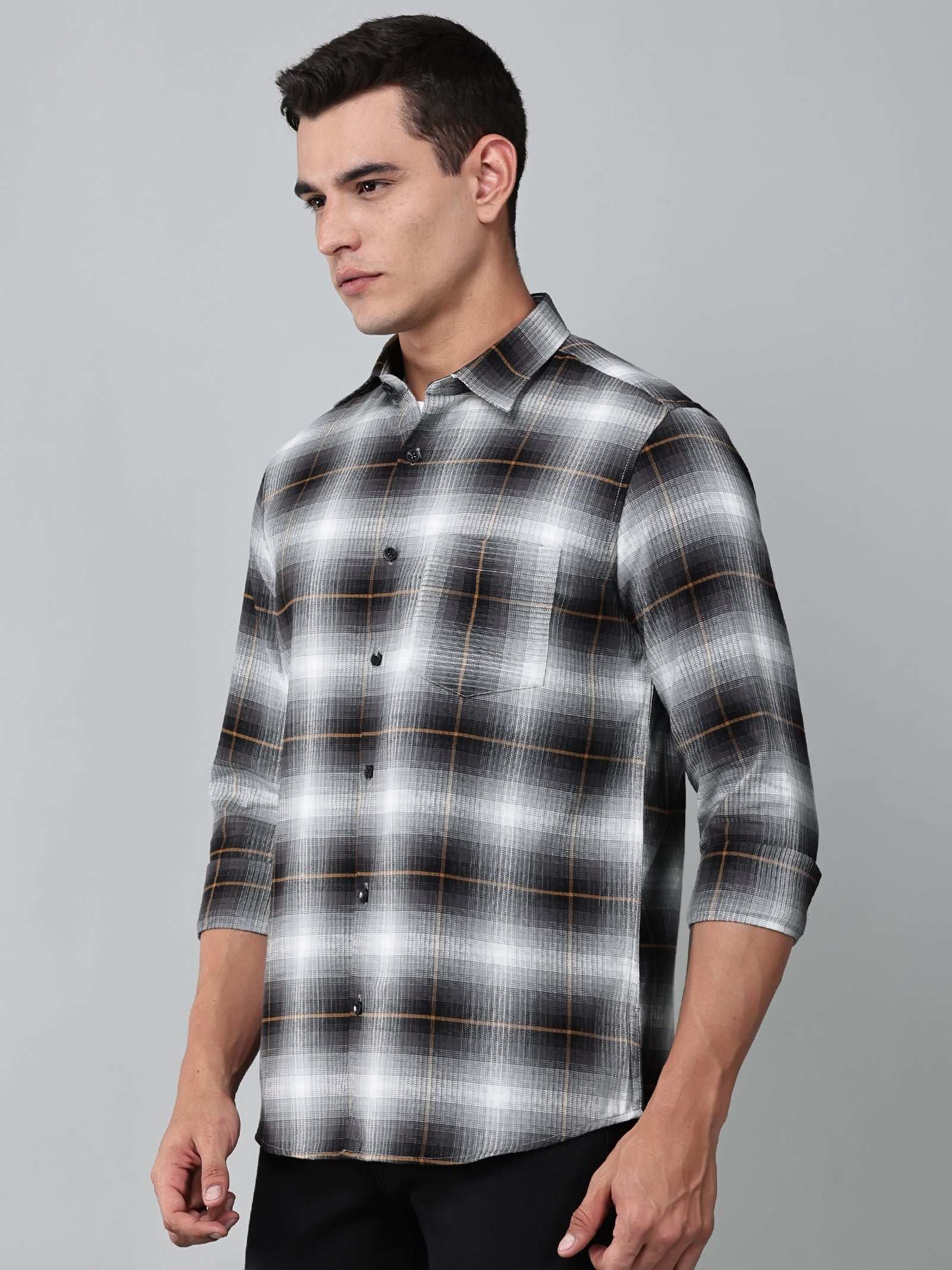 a model wearing a graphite gradient checkered shirt