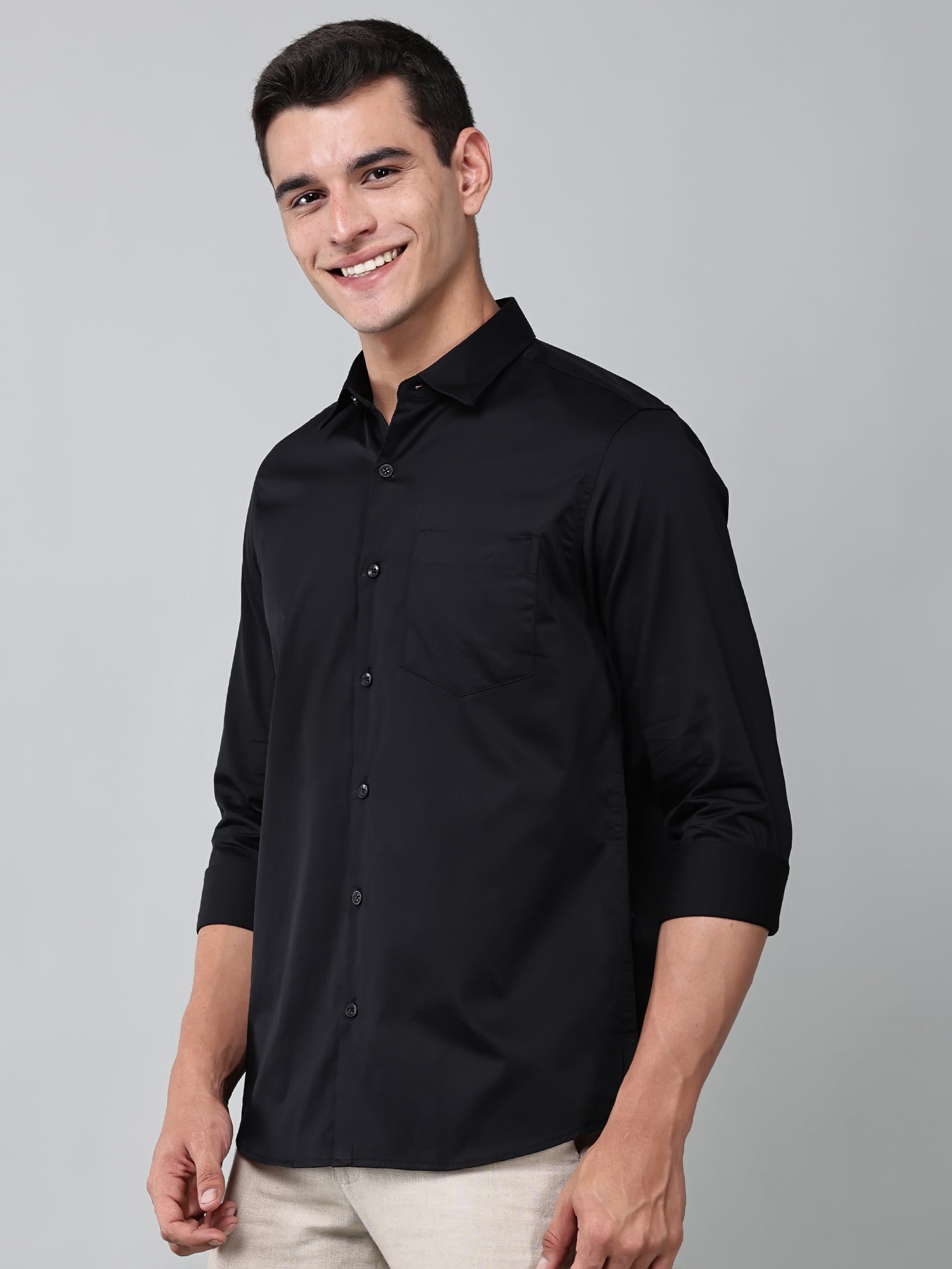 a model wearing a luxe satin black shirt