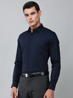 a model wearing a signature textured stretch formal navy blue shirt