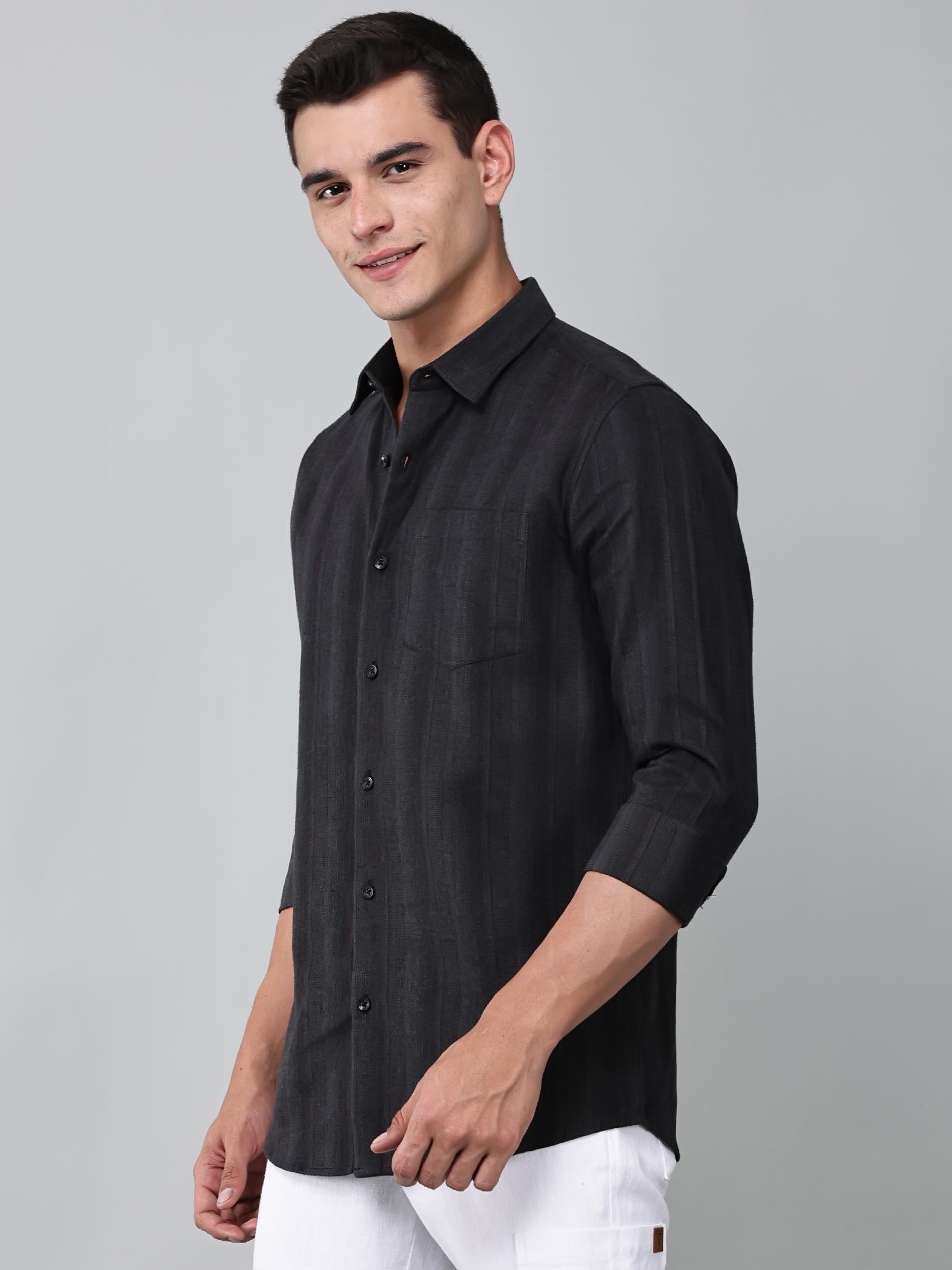 a model wearing a midnight noir (black) obsidian shirt