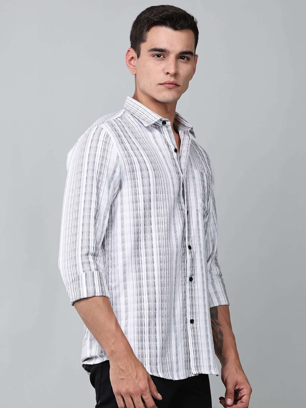 model wearing a white and charcoal textured stripe shirt