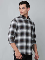 a model wearing a graphite gradient checkered shirt