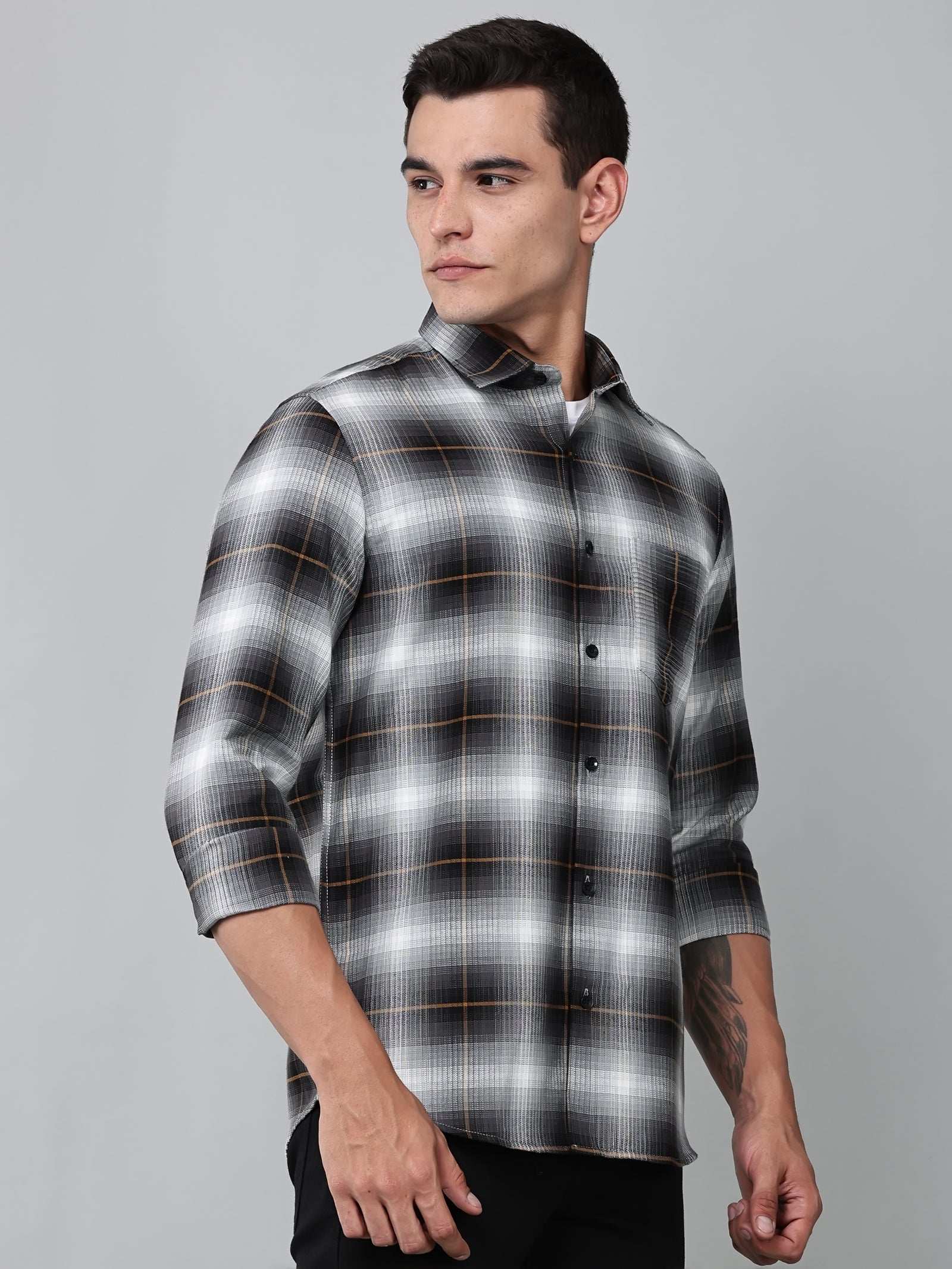 a model wearing a graphite gradient checkered shirt