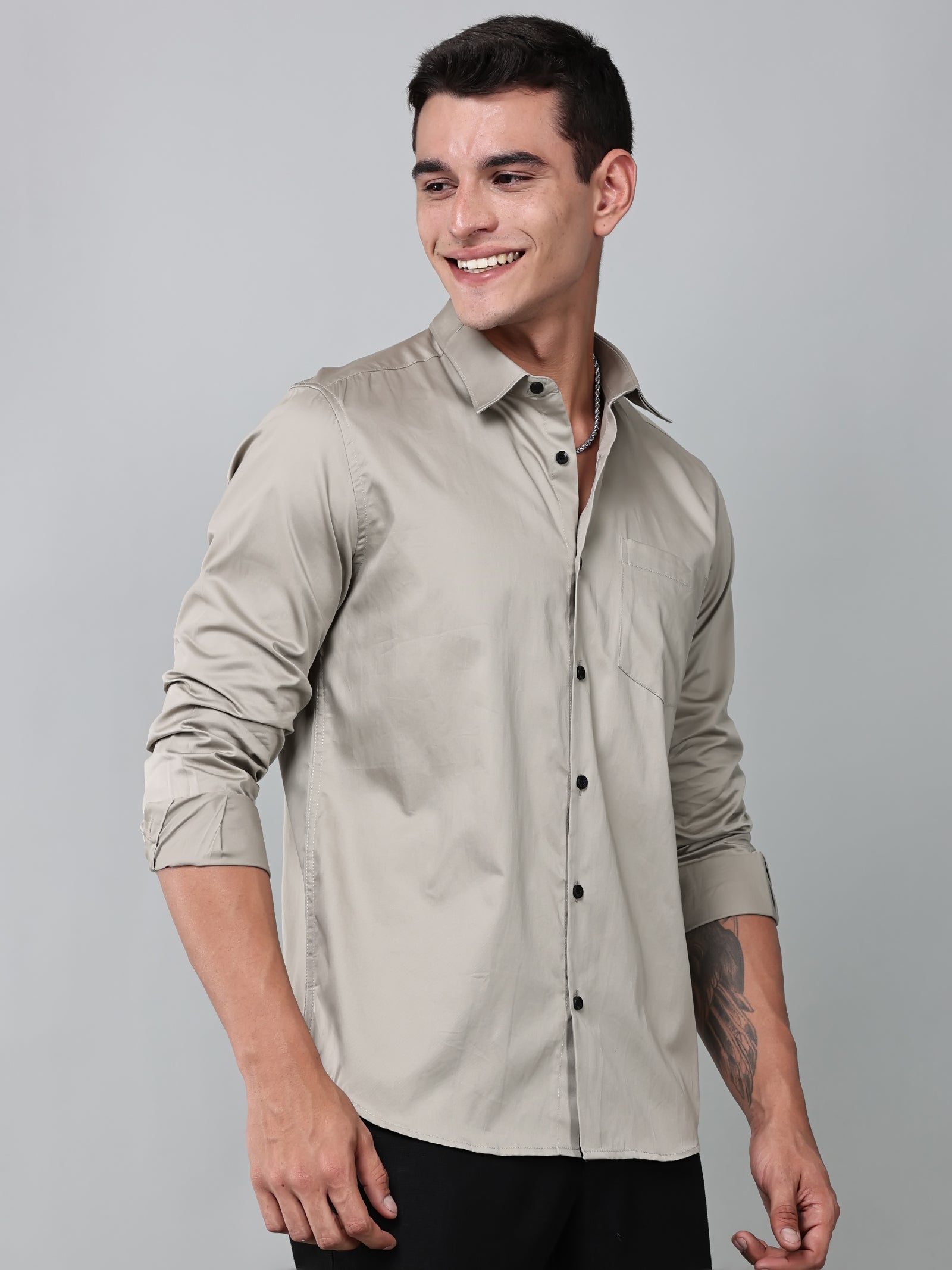 a model wearing a luxe satin ivory stone shirt