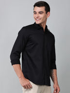 a model wearing a luxe satin black shirt