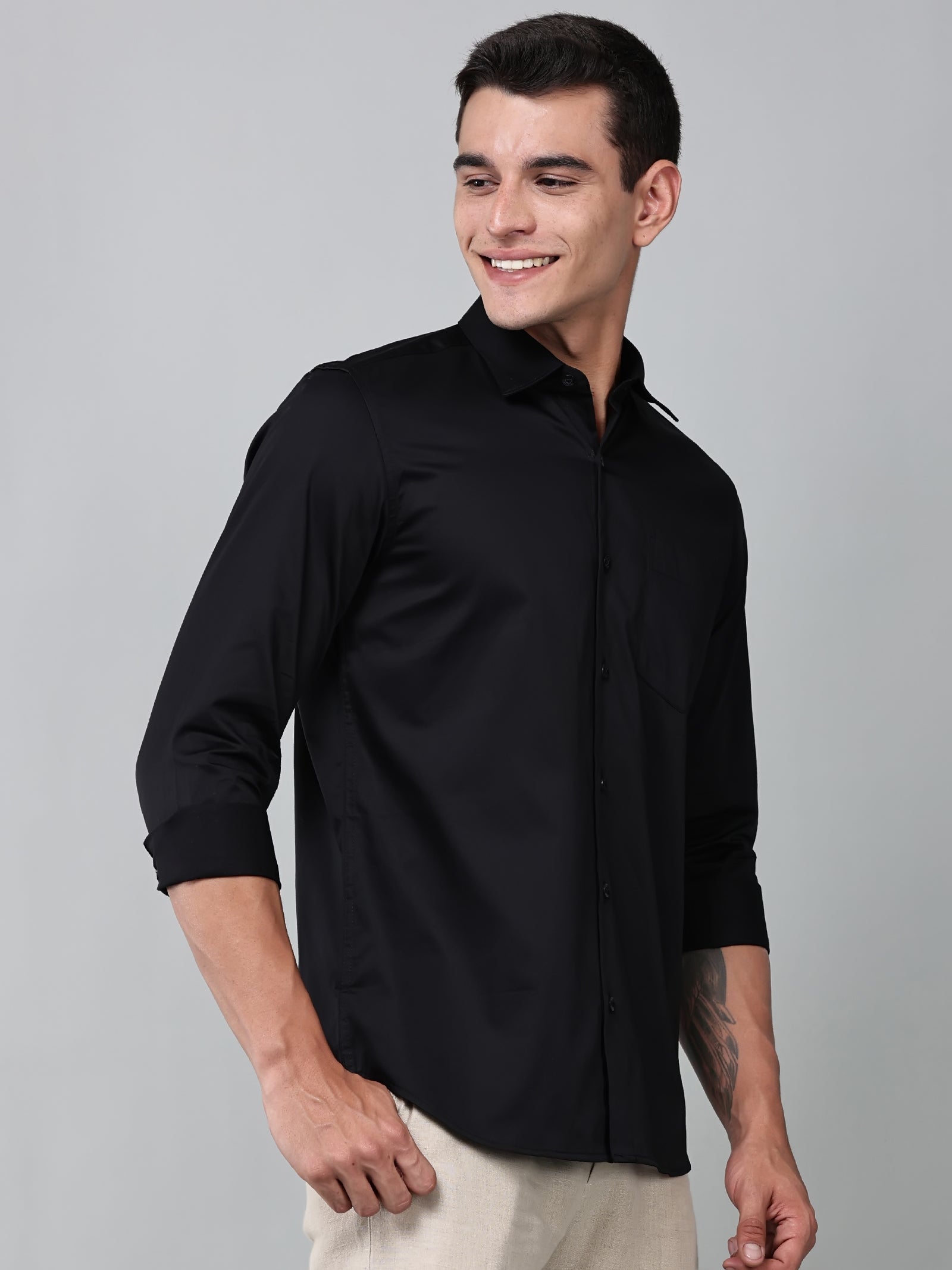 a model wearing a luxe satin black shirt