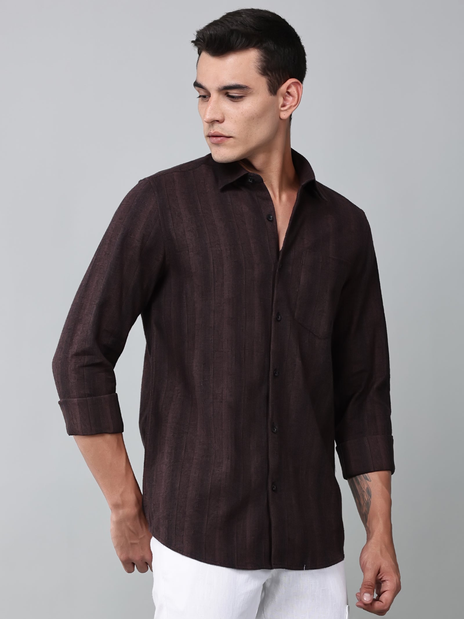a model wearing a midnight noir (black) maroon shirt