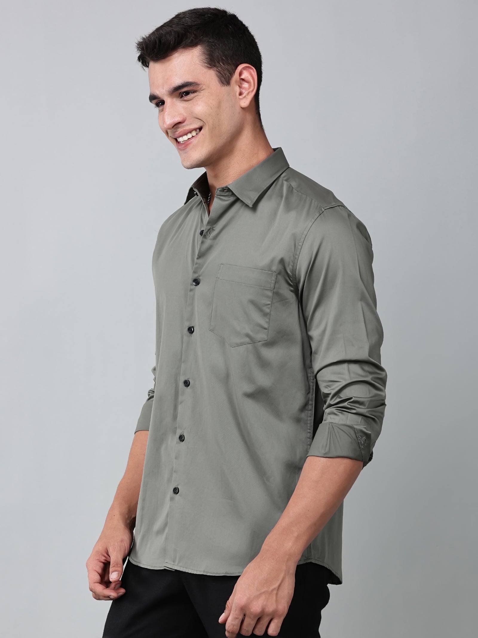 a model wearing a luxe satin olive green shirt