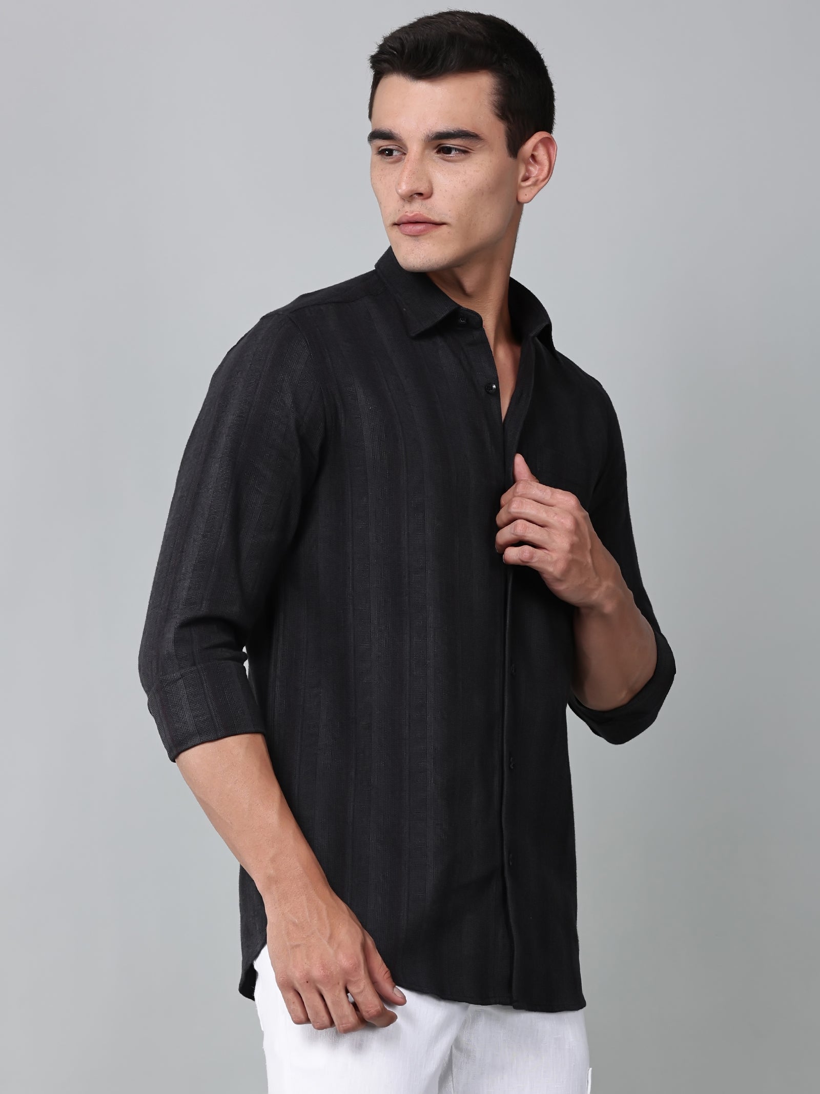 a model wearing a midnight noir (black) obsidian shirt