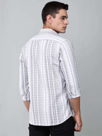 model wearing a white and charcoal textured stripe shirt