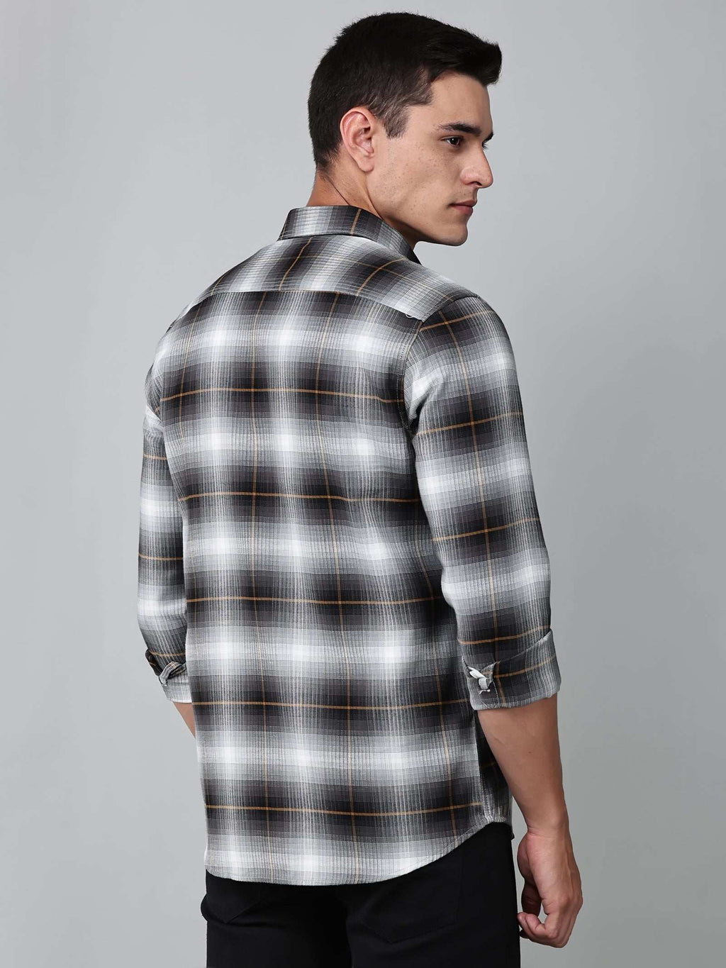 a model wearing a graphite gradient checkered shirt