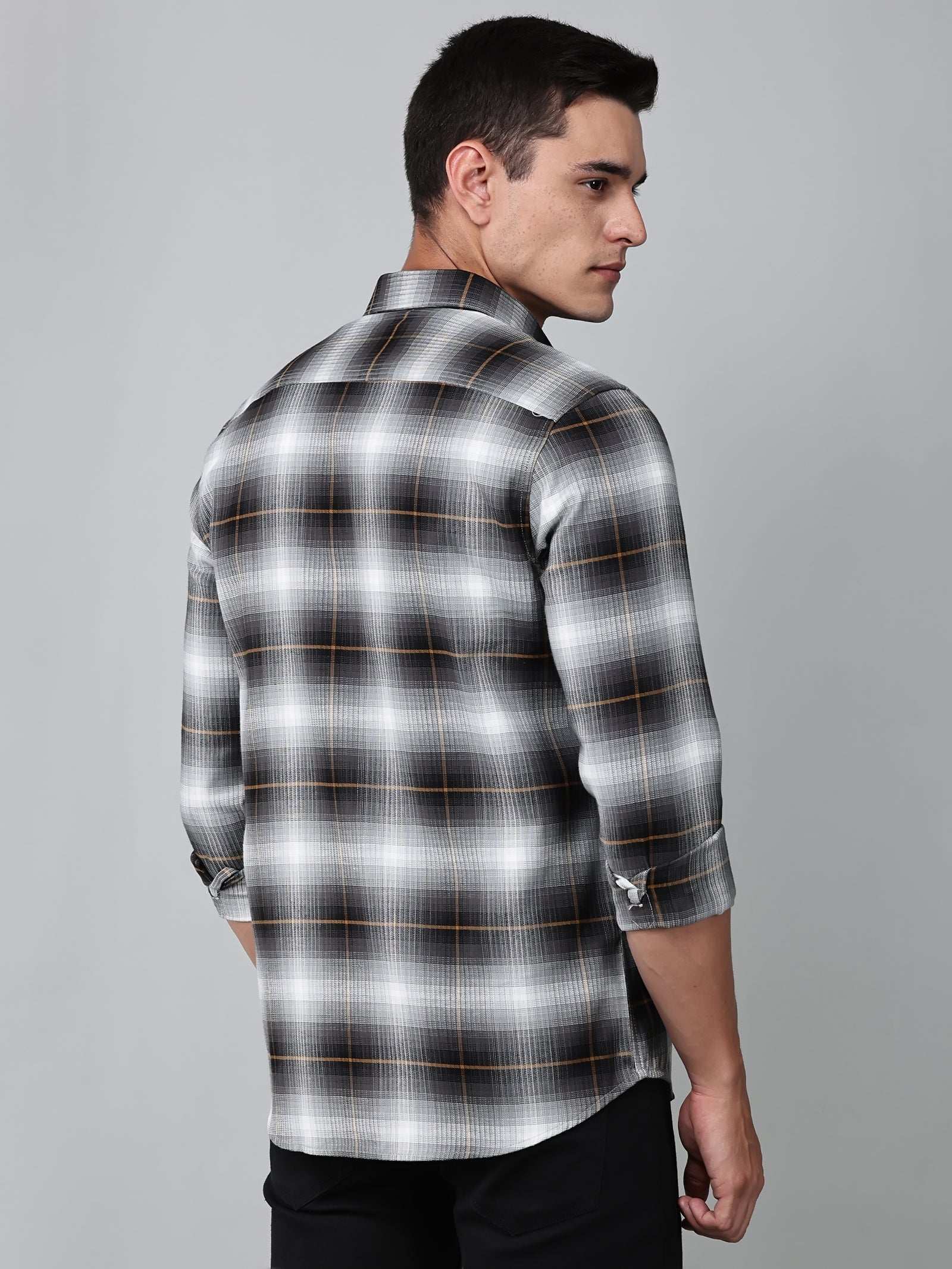 a model wearing a graphite gradient checkered shirt