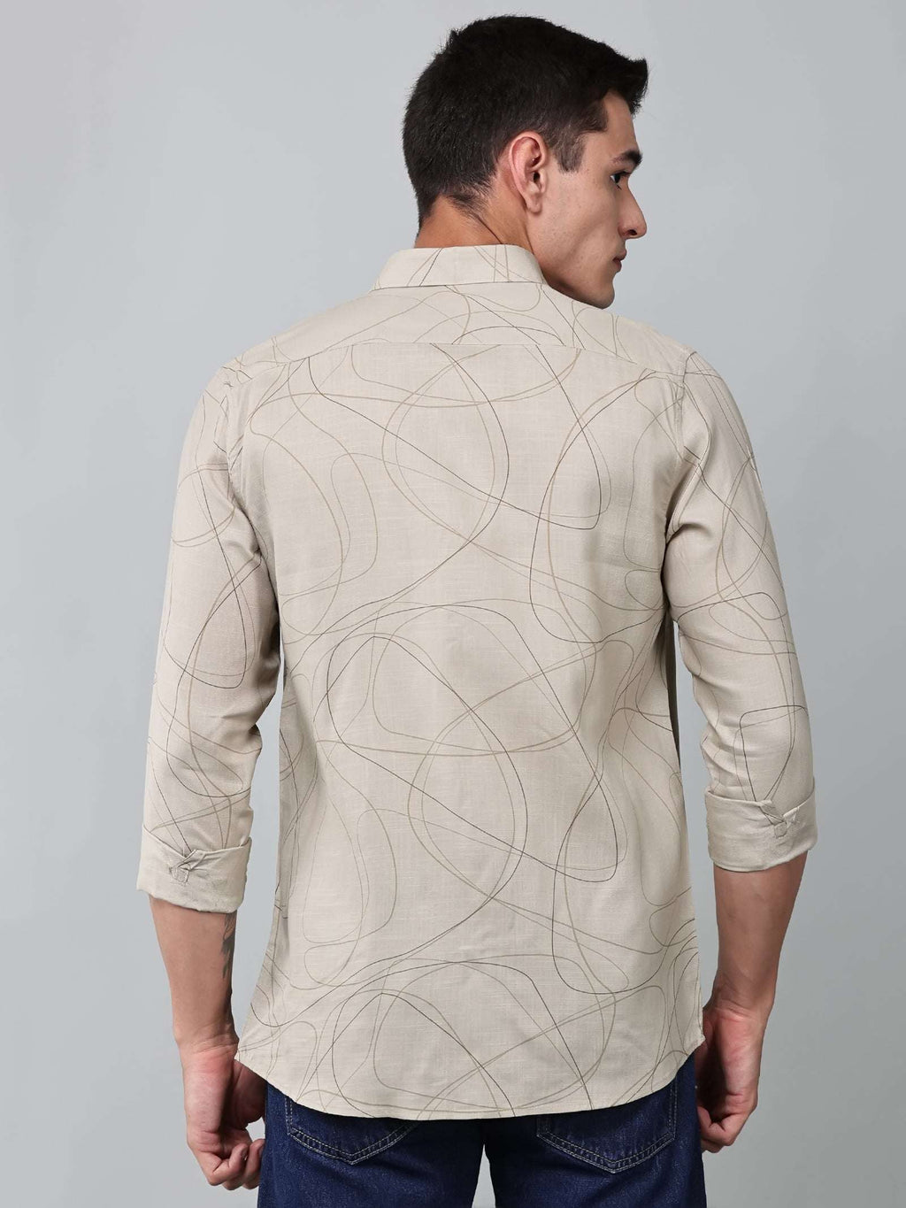 a model wearing a linear drift sketch beige shirt