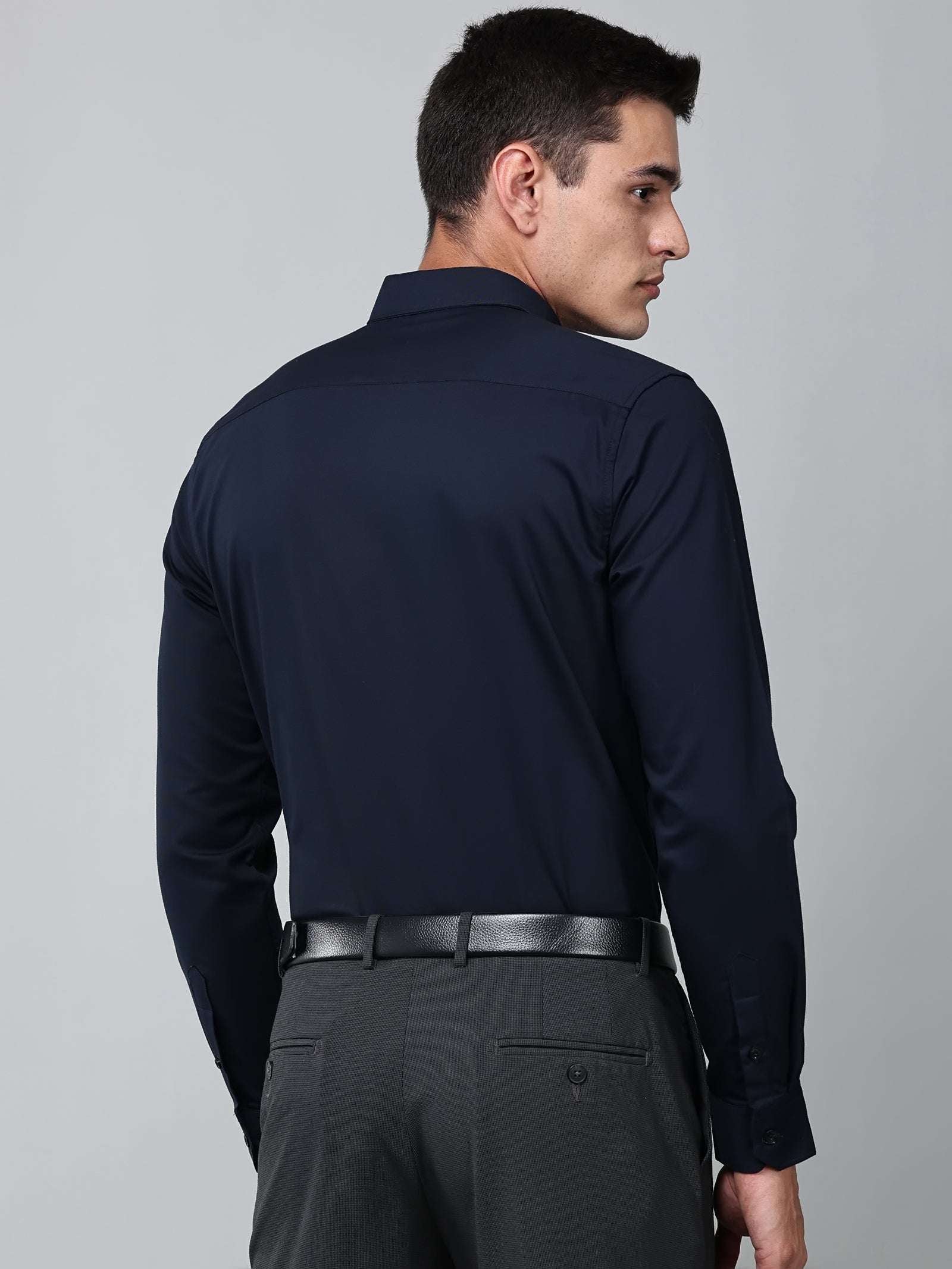 a model wearing a signature textured stretch formal navy blue shirt