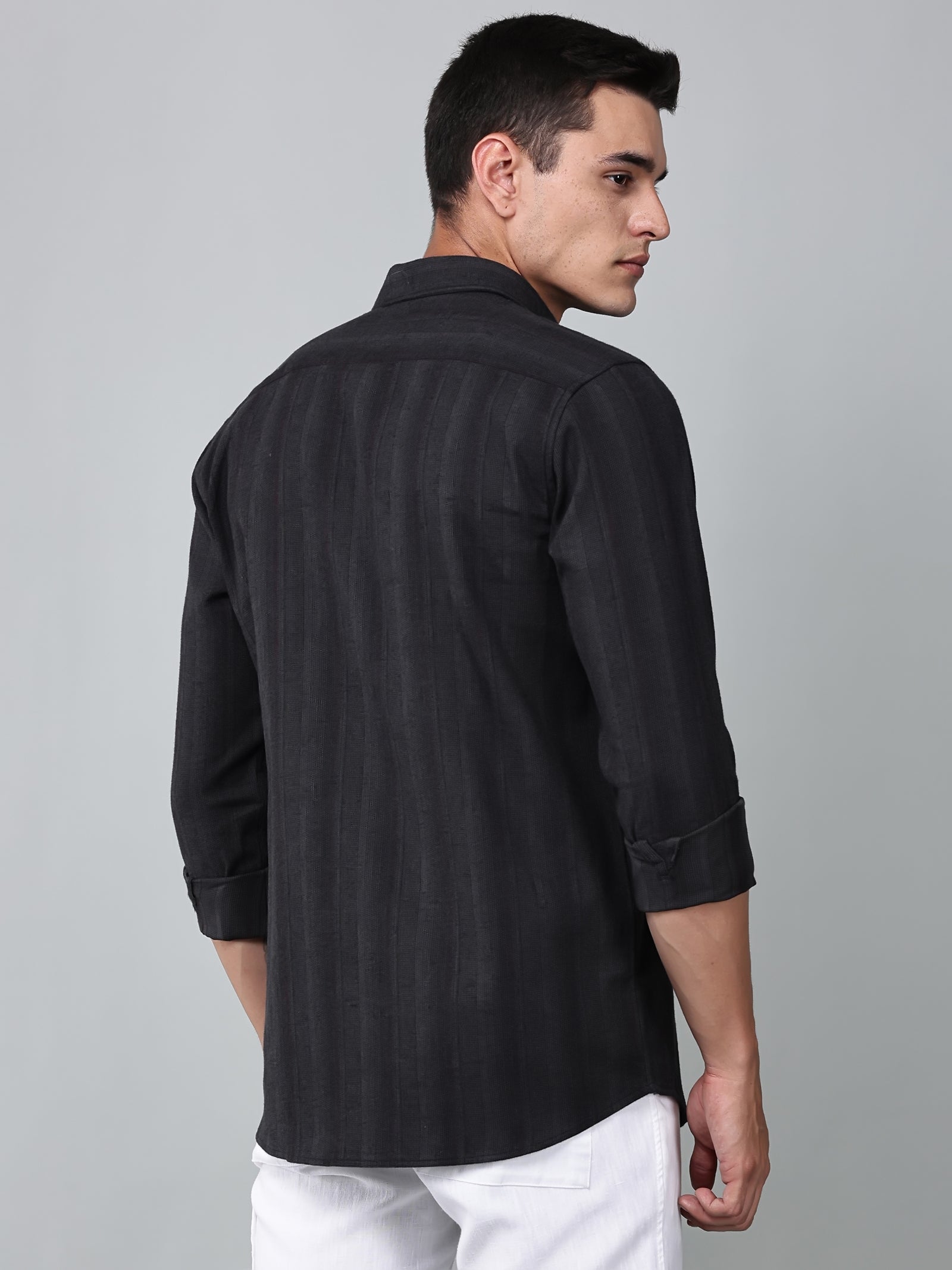 a model wearing a midnight noir (black) obsidian shirt