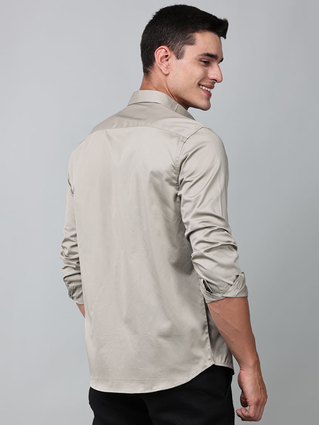 a model wearing a luxe satin ivory stone shirt