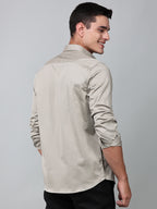 a model wearing a luxe satin ivory stone shirt