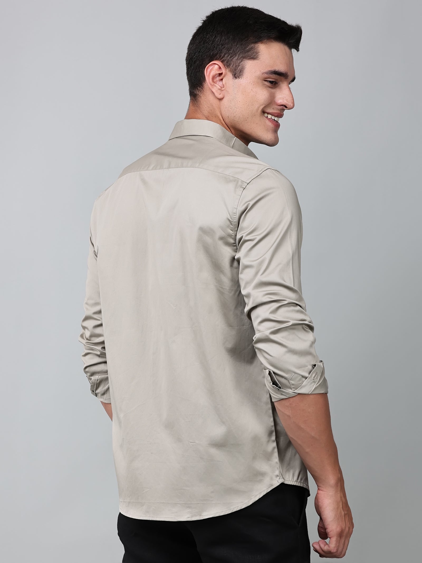 a model wearing a luxe satin ivory stone shirt