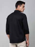 a model wearing a luxe satin black shirt