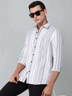 model wearing a white and charcoal textured stripe shirt