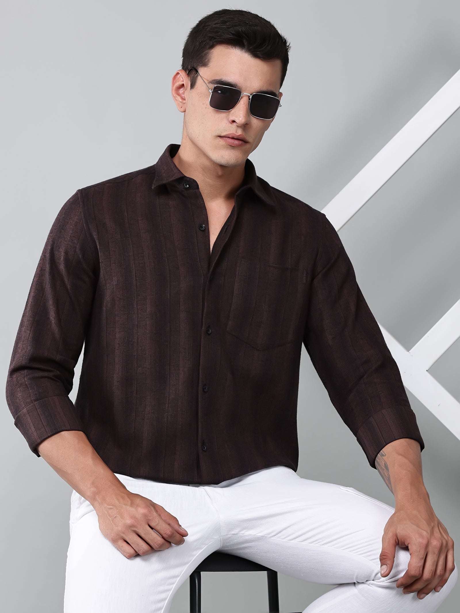 a model wearing a midnight noir (black) maroon shirt