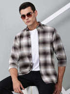 a model wearing a crimson (red) ombre checkered shirt