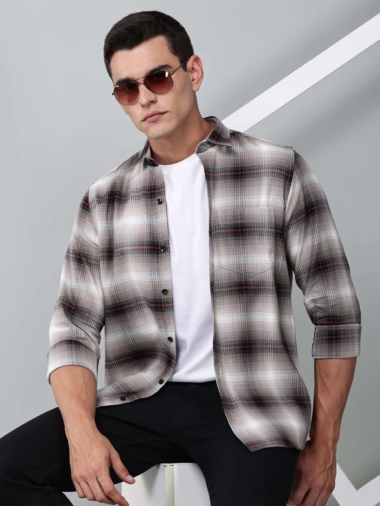 a model wearing a crimson (red) ombre checkered shirt