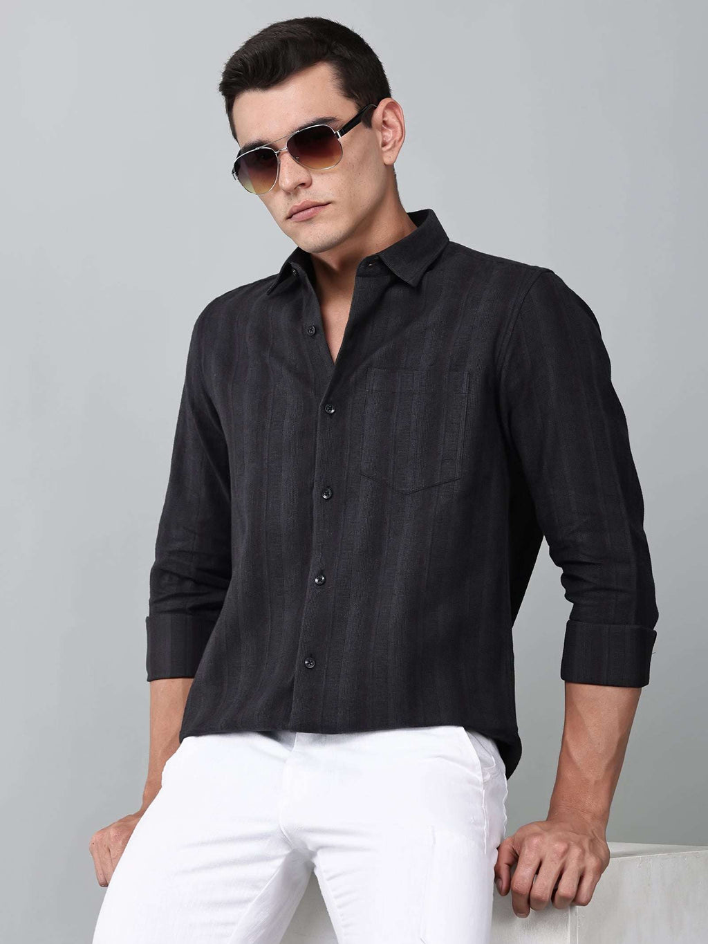 a model wearing a midnight noir (black) obsidian shirt
