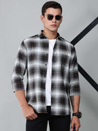 a model wearing a graphite gradient checkered shirt