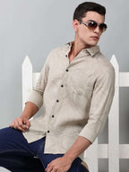 a model wearing a linear drift sketch beige shirt with sunglasses