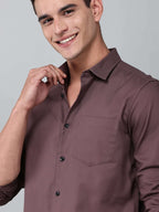 close up shot of a model wearing a contour textured dusty rose shirt