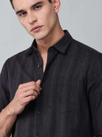 close up shot of a model wearing a midnight noir (black) obsidian shirt