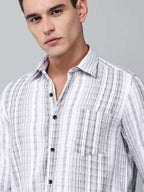 close up shot of a model wearing a white and charcoal textured stripe shirt