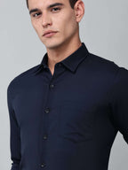 close up shot of a model wearing a signature textured stretch formal navy blue shirt