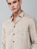 close up shot of the model wearing a linear drift sketch beige shirt