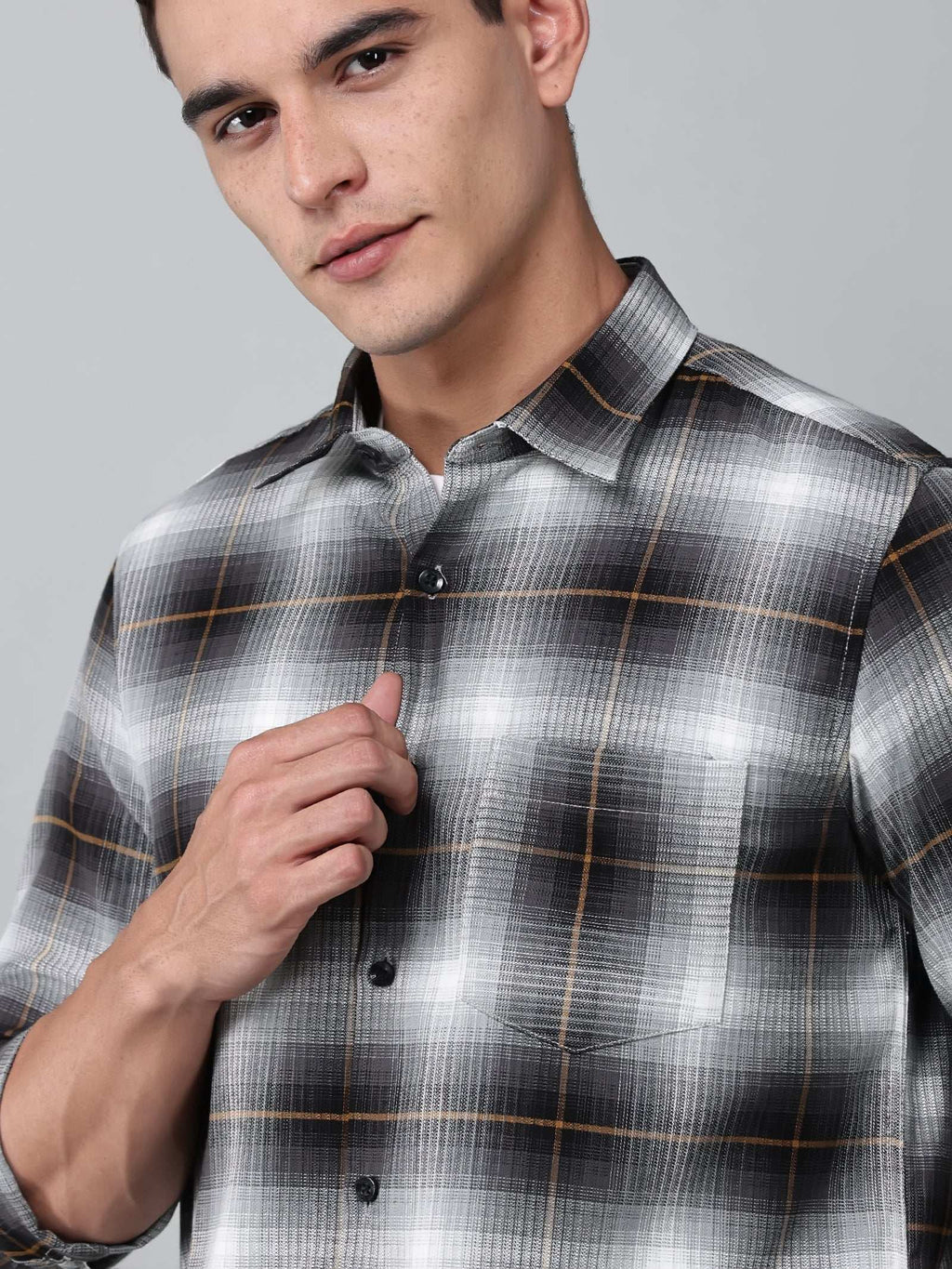 close up shot of the model wearing a graphite gradient checkered shirt