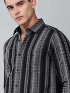 close up shot of the model wearing a noir (black) echo textured stripe shirt