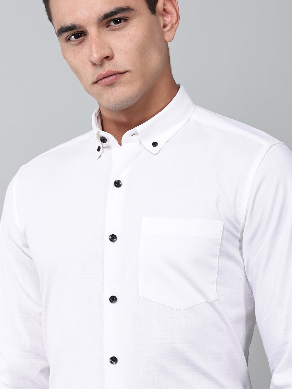 close up shot of a model wearing a white heritage linen luxe shirt
