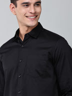 close up shot of a model wearing a luxe satin black shirt