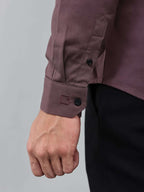 close up shot of the cuff sleeve of the contour textured dusty rose shirt