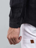 close up shot of the cuff sleeve of the midnight noir (black) obsidian shirt