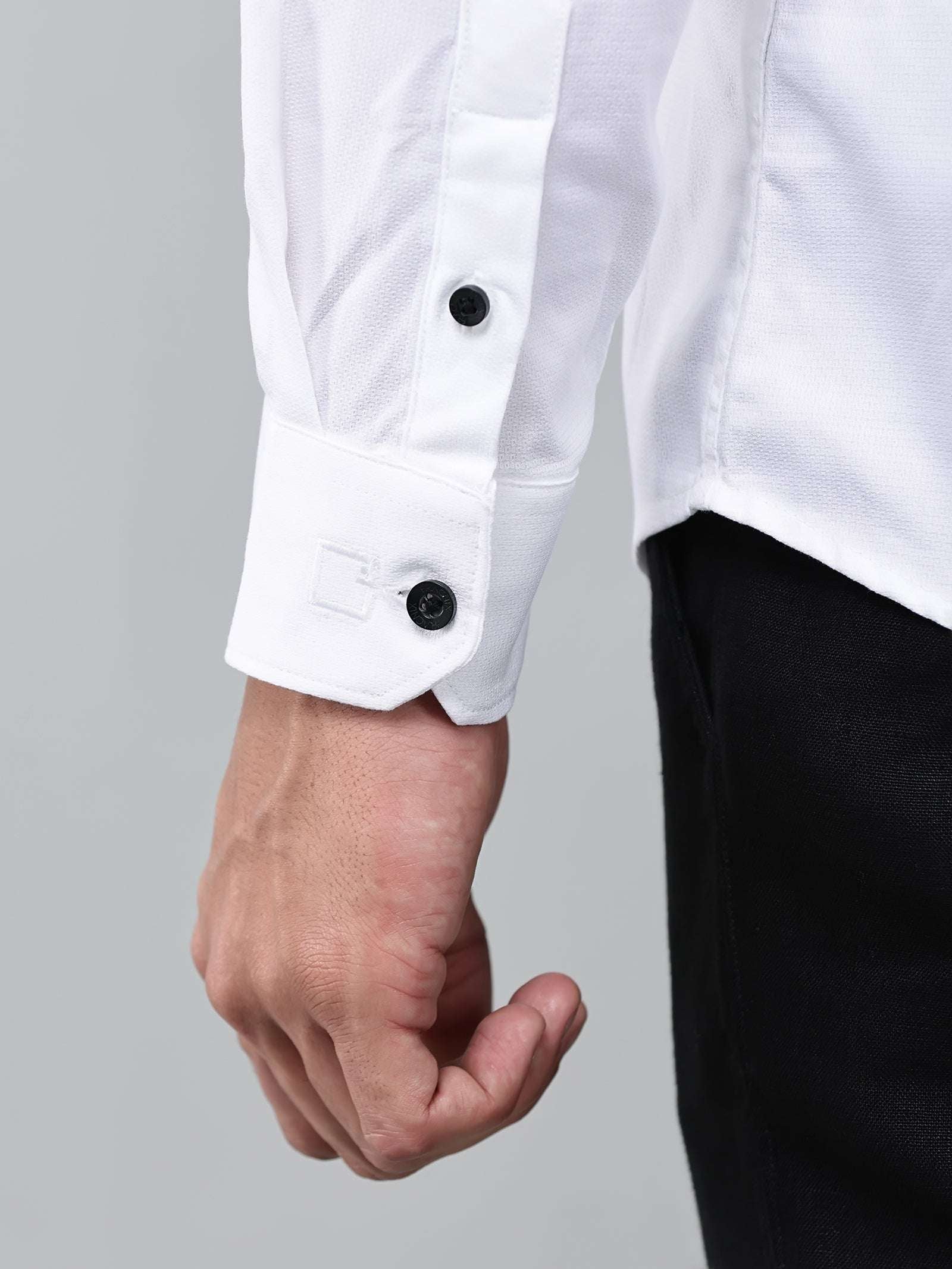 close up shot of the cuff sleeve of the contour textured classy white shirt