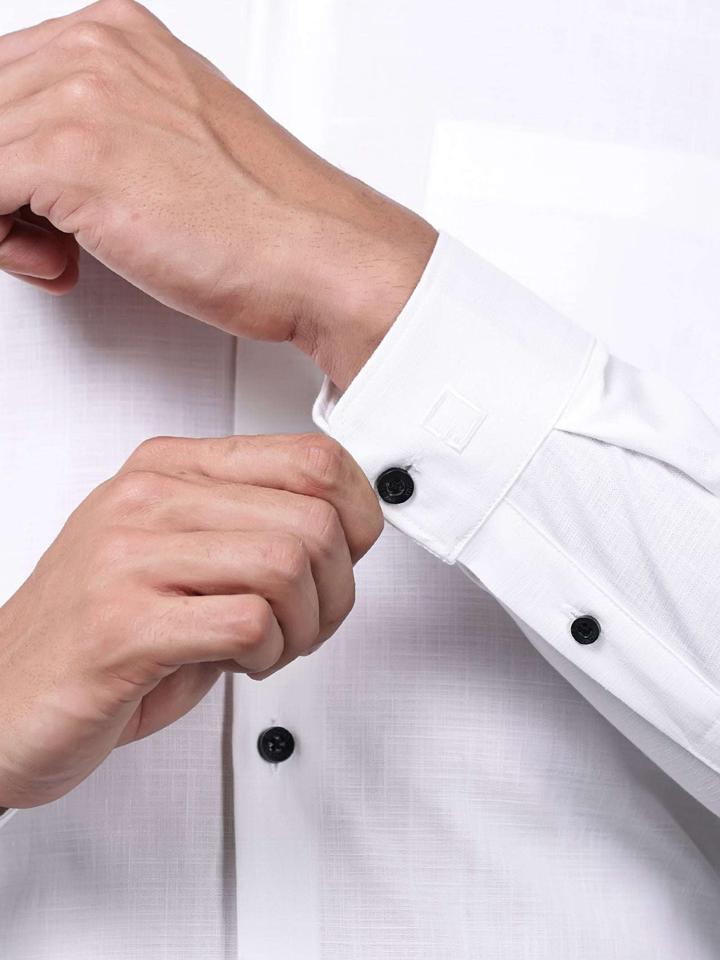 close up shot of a cuff sleeve of the white heritage linen luxe shirt