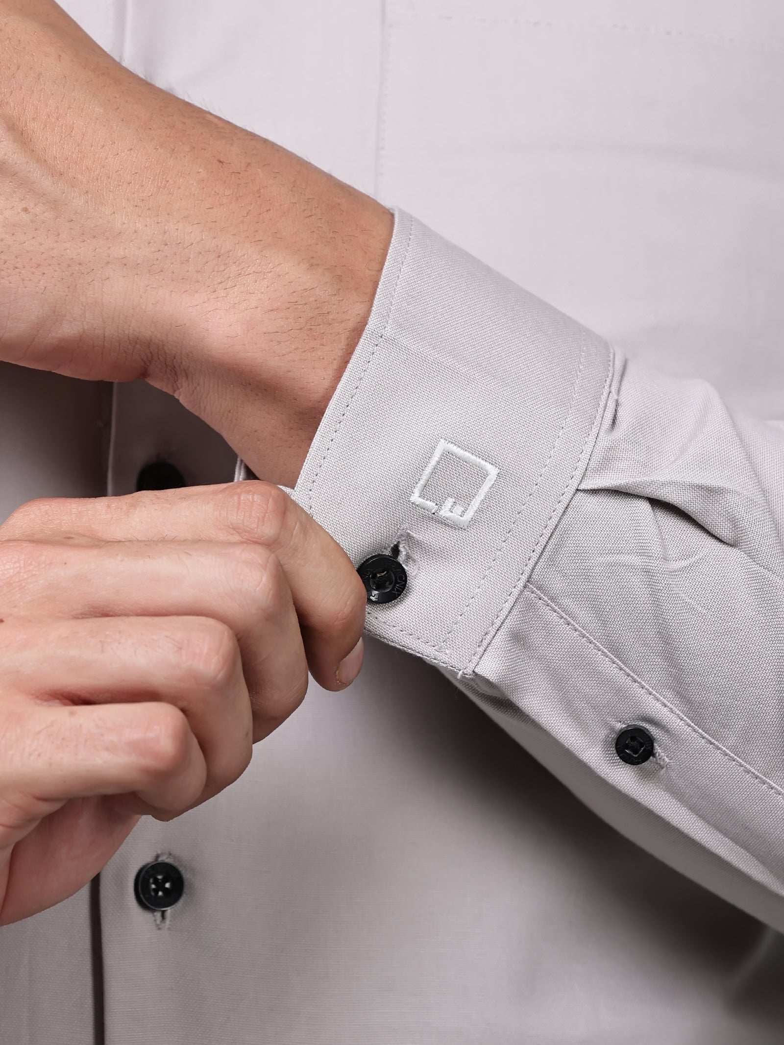 close up shot of the cuff sleeve of the signature textured stretch formal dusk shirt