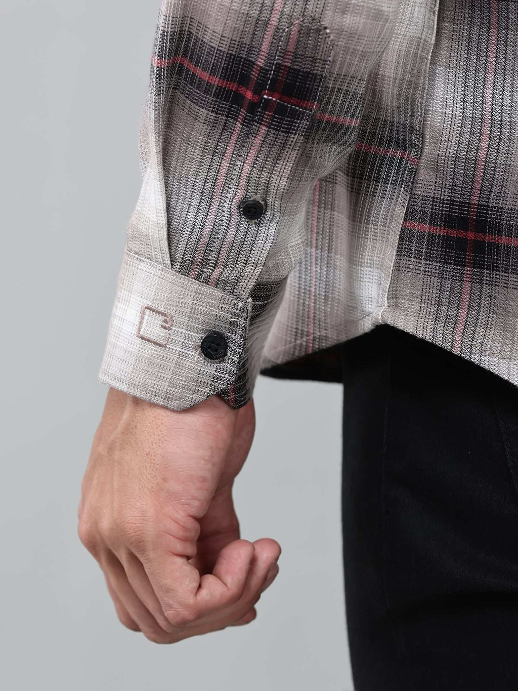 close up shot of the cuff sleeve of the crimson (red) ombre checkered shirt